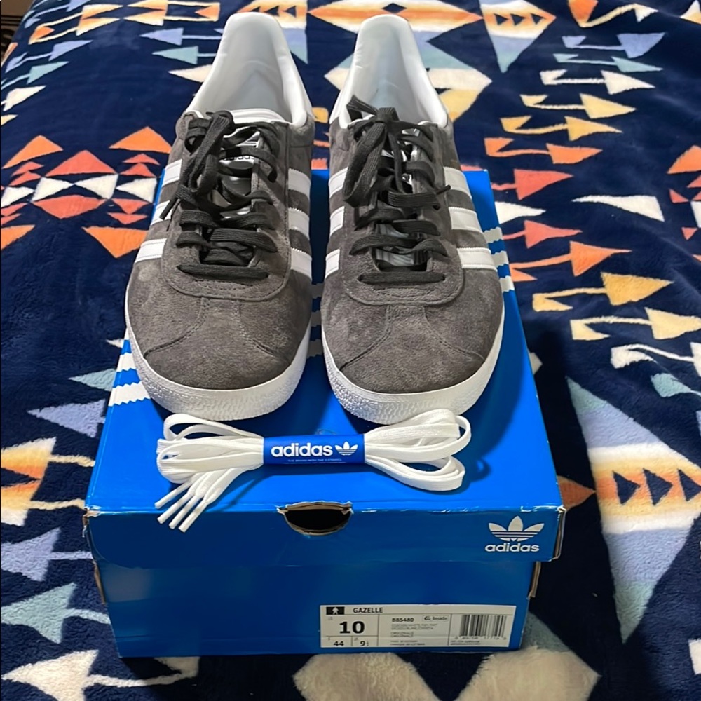 adidas gray suede sneakers with white stripes and low-top design